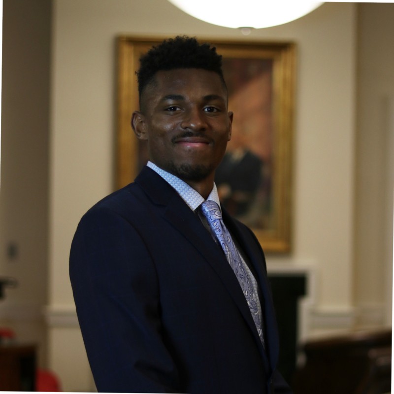 A smiling man in a suit